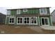 Unfinished two-story home featuring large windows and a sliding door in an unfinished construction stage at 4947 Amber Crest Dr, Brownsburg, IN 46112