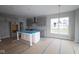 Spacious kitchen with gray cabinets, an island, and modern fixtures; ideal for cooking and entertaining guests at 4947 Amber Crest Dr, Brownsburg, IN 46112