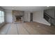 Spacious living room featuring a stone fireplace and large windows for ample natural light at 4947 Amber Crest Dr, Brownsburg, IN 46112
