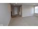 A cozy living area featuring neutral walls, plush carpeting, and ample space for relaxation and entertainment at 4947 Amber Crest Dr, Brownsburg, IN 46112