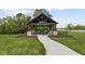 Community pavilion with picnic tables and stone accents, perfect for outdoor gatherings at 4947 Amber Crest Dr, Brownsburg, IN 46112