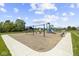 Community playground featuring swings, slides, and a shaded picnic area for residents at 4947 Amber Crest Dr, Brownsburg, IN 46112