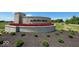 Landscaped community sign with flowers and shrubbery reading, 