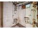 Unfinished basement area showcasing exposed pipes and utilities, offering potential for functional improvements or storage at 5035 Boulevard Pl, Indianapolis, IN 46208