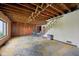 Unfinished basement with exposed beams and stairway at 5035 Boulevard Pl, Indianapolis, IN 46208
