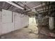 Unfinished basement space features a concrete floor, exposed duct work, and available utilities for versatile use at 5035 Boulevard Pl, Indianapolis, IN 46208