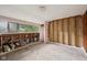 A bedroom interior featuring exposed wall studs and windows at 5035 Boulevard Pl, Indianapolis, IN 46208