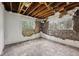 Bedroom with exposed brick, two windows and damage from renovation at 5035 Boulevard Pl, Indianapolis, IN 46208