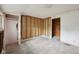A bedroom interior featuring an open closet and unfinished walls at 5035 Boulevard Pl, Indianapolis, IN 46208