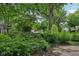 Exterior view of a lush yard with mature trees and green foliage at 5035 Boulevard Pl, Indianapolis, IN 46208