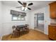 Cozy dining area features a ceiling fan, vinyl flooring, and natural light from the window at 5092 S 50 W, Anderson, IN 46013