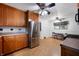 Spacious kitchen featuring a stainless steel refrigerator, ceiling fan, and tile flooring at 5092 S 50 W, Anderson, IN 46013