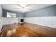Bright living room with a decorative fireplace, hardwood floors, and ample space at 5092 S 50 W, Anderson, IN 46013