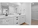 Modern bathroom with double sinks, a large mirror, and stylish black hardware at 5925 Sterling Dr, Whitestown, IN 46075