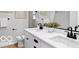 Modern bathroom with double sinks and white cabinets at 5925 Sterling Dr, Whitestown, IN 46075