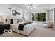 Cozy primary bedroom with a large window and contemporary decor at 5925 Sterling Dr, Whitestown, IN 46075