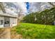 Lush backyard featuring a well-maintained lawn and mature landscaping at 5939 Olivia Dr, Alexandria, IN 46001