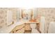 Charming bathroom with floral wallpaper, featuring a sink and vanity with storage space at 5939 Olivia Dr, Alexandria, IN 46001