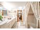 Well-lit bathroom with a double vanity, shower, and floral accents at 5939 Olivia Dr, Alexandria, IN 46001