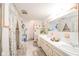 Bathroom with a double sink vanity and floral curtains at 5939 Olivia Dr, Alexandria, IN 46001