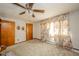 Light-filled bedroom featuring neutral walls, wood trim, and carpet at 5939 Olivia Dr, Alexandria, IN 46001
