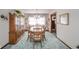 Charming dining room featuring a chandelier, a china cabinet, and ample natural light at 5939 Olivia Dr, Alexandria, IN 46001