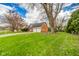 Charming brick home with a two-car garage, and a large, well-manicured front yard at 5939 Olivia Dr, Alexandria, IN 46001