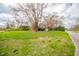 Well-maintained yard with mature trees surrounding this charming residential property at 5939 Olivia Dr, Alexandria, IN 46001