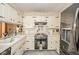 Efficient kitchen layout with white cabinets, black appliances, and plenty of counter space at 5939 Olivia Dr, Alexandria, IN 46001