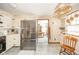 Well-equipped kitchen featuring stainless steel refrigerator and an easy view into the dining area at 5939 Olivia Dr, Alexandria, IN 46001