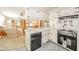 Functional kitchen with black appliances, a breakfast bar, and seamless access to the living area at 5939 Olivia Dr, Alexandria, IN 46001