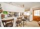 Kitchen bar area featuring barstool seating, seamlessly connecting to a separate dining area at 5939 Olivia Dr, Alexandria, IN 46001