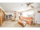Open-concept living space with multiple seating areas, ceiling fans, and natural light at 5939 Olivia Dr, Alexandria, IN 46001
