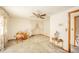 Bright and airy room with a desk, chair, floral curtains, and a ceiling fan at 5939 Olivia Dr, Alexandria, IN 46001
