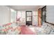 Cozy sunroom featuring comfortable seating and views of the landscaped backyard at 5939 Olivia Dr, Alexandria, IN 46001