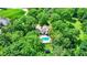 Stunning aerial view of estate home with in-ground pool surrounded by mature trees at 5953 Deer Hollow Ct, Pittsboro, IN 46167