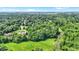 Beautiful aerial view of expansive wooded acreage with lush landscaping and luxurious homes at 5953 Deer Hollow Ct, Pittsboro, IN 46167