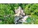 An aerial view of a home featuring a backyard swimming pool and brick accents at 5953 Deer Hollow Ct, Pittsboro, IN 46167