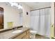 Cozy bathroom with a shower curtain, single sink vanity, and warm lighting at 5953 Deer Hollow Ct, Pittsboro, IN 46167