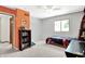 Bright bedroom with orange accent wall, window, and neutral carpet at 5953 Deer Hollow Ct, Pittsboro, IN 46167