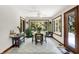 Bright breakfast nook surrounded by windows with backyard views, a ceiling fan, and room for dining at 5953 Deer Hollow Ct, Pittsboro, IN 46167