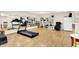 Bright exercise area complete with a treadmill, massage chair, and storage shelves at 5953 Deer Hollow Ct, Pittsboro, IN 46167