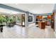 Open kitchen with a large island, tile floor, and a breakfast nook overlooking the backyard at 5953 Deer Hollow Ct, Pittsboro, IN 46167