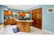 A well-lit kitchen featuring a center island, stainless steel appliances, and ample wood cabinetry at 5953 Deer Hollow Ct, Pittsboro, IN 46167