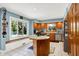 This spacious kitchen is complemented with stainless steel appliances, wood cabinets, and natural lighting at 5953 Deer Hollow Ct, Pittsboro, IN 46167