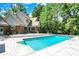 Stunning backyard featuring in-ground pool and patio with manicured landscaping at 5953 Deer Hollow Ct, Pittsboro, IN 46167