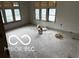Room with many windows awaiting renovation at 609 E 37Th St, Indianapolis, IN 46205