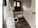 A staircase leads to the second floor, with the surrounding elements prepped for customization at 609 E 37Th St, Indianapolis, IN 46205