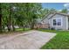 Backyard view of a gray house with trees and lawn at 617 N Dearborn St, Indianapolis, IN 46201
