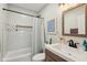 Bathroom features a shower with updated tile, a modern vanity, and decorative accents at 617 N Dearborn St, Indianapolis, IN 46201